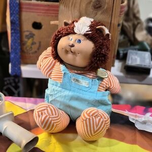 Adorable Plush Toy with Striped Outfit